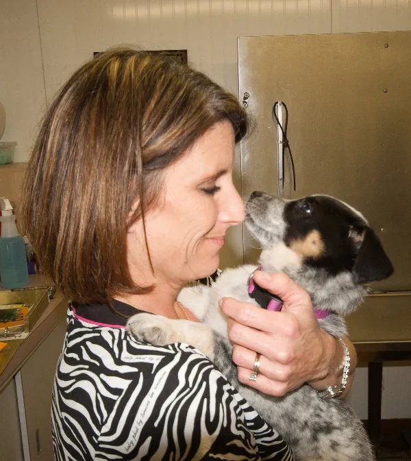 D'Anne R. Stephens, DVM, holding a puppy